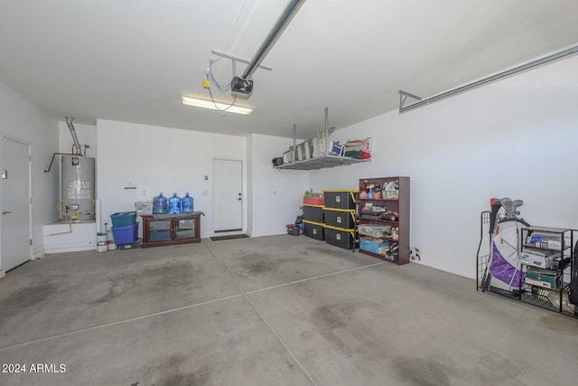 garage featuring gas water heater and a garage door opener