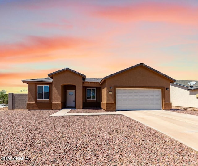 view of front of property featuring a garage