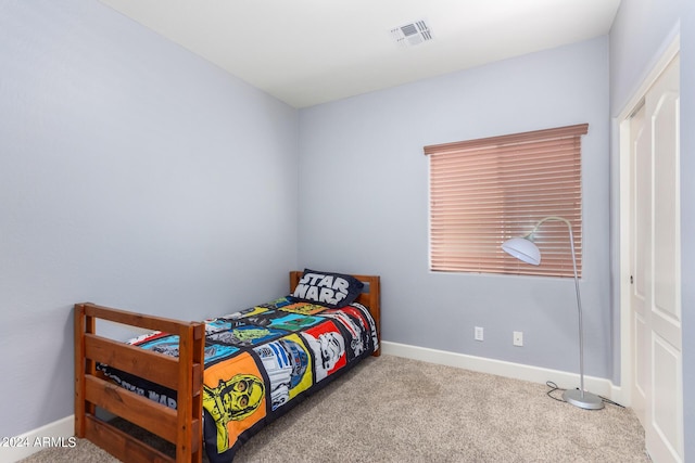 bedroom with visible vents, baseboards, and carpet flooring