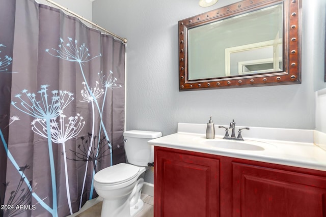 bathroom featuring a shower with shower curtain, toilet, and vanity