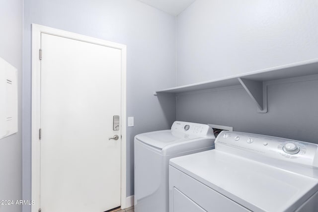 laundry room with washing machine and clothes dryer and laundry area