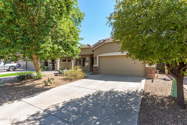 obstructed view of property featuring a garage