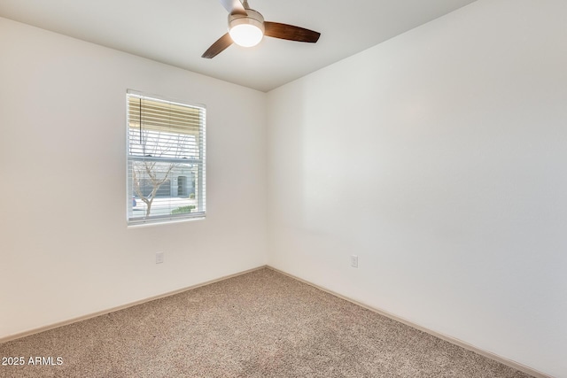 unfurnished room featuring carpet floors, ceiling fan, and baseboards