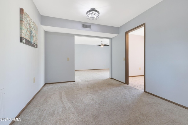 carpeted empty room with ceiling fan