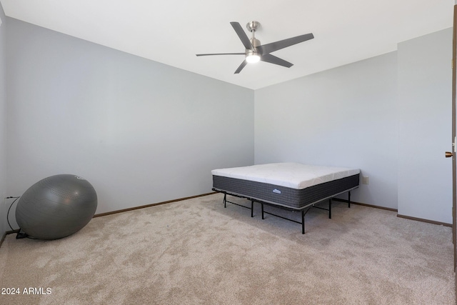 bedroom with light carpet and ceiling fan