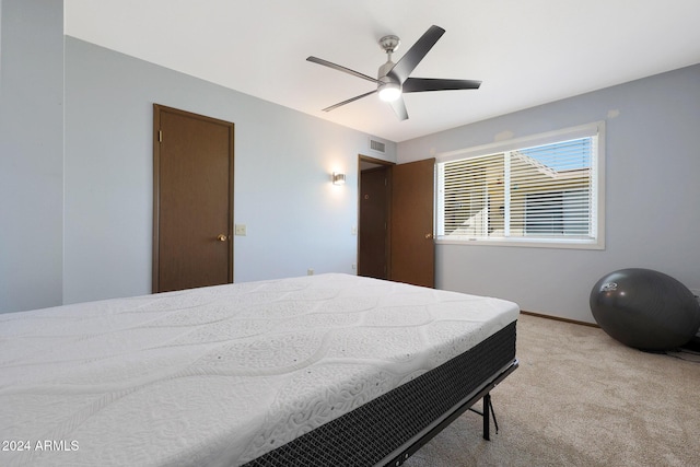 carpeted bedroom featuring ceiling fan