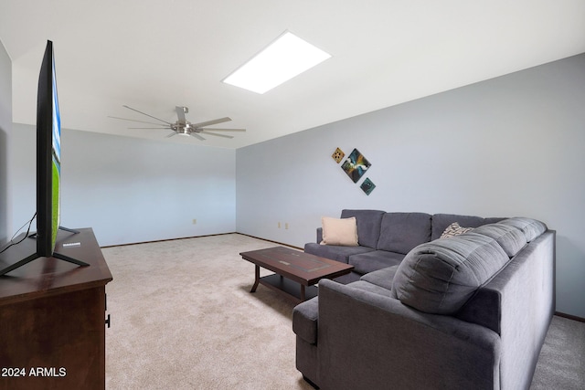 living room featuring light carpet and ceiling fan