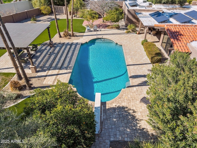 view of pool with a patio area, fence, and a fenced in pool