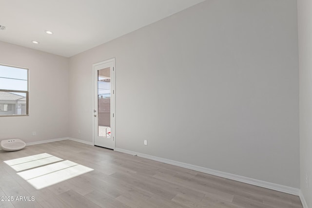 empty room featuring light hardwood / wood-style floors