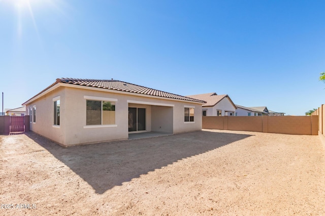 rear view of property featuring a patio