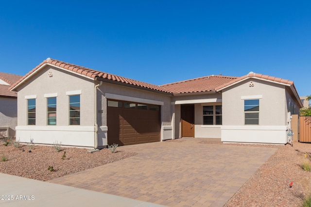 mediterranean / spanish house with a garage