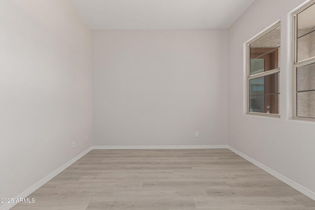 spare room featuring light hardwood / wood-style floors