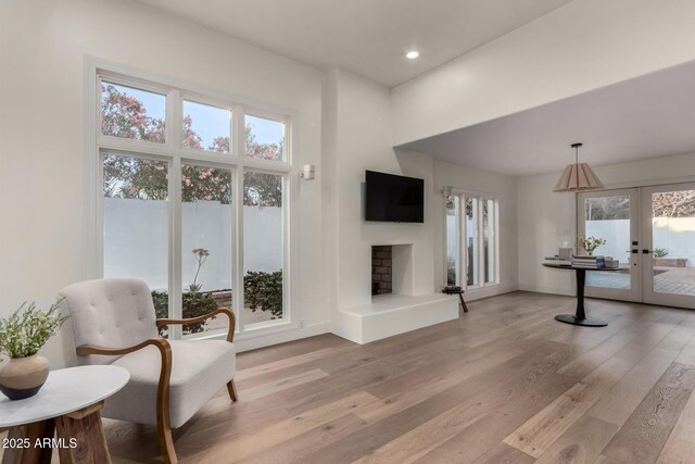 106 E Echo Ln, Phoenix, AZ 85020 - interior space with light wood-style flooring, french doors, and plenty of natural light