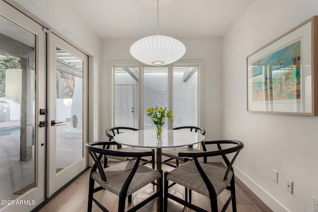 106 E Echo Ln, Phoenix, AZ 85020 - dining room with baseboards and light wood finished floors