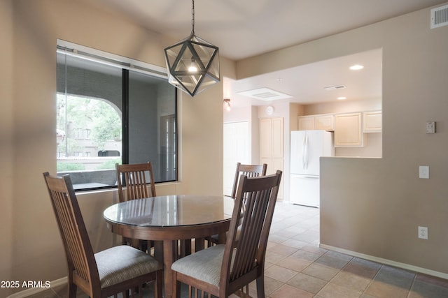 dining area featuring light tile patterned floors, baseboards, and recessed lighting