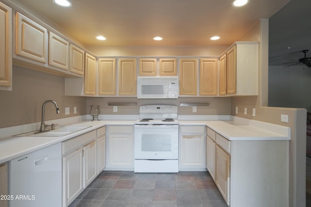 kitchen featuring white appliances, a sink, ceiling fan, recessed lighting, and light countertops