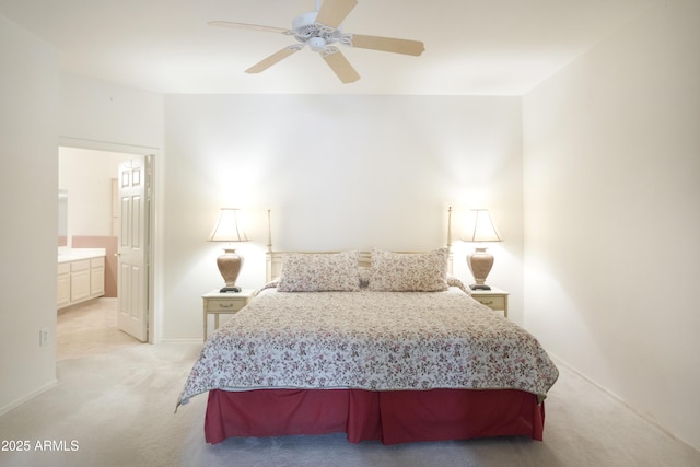 bedroom with light colored carpet, baseboards, connected bathroom, and ceiling fan