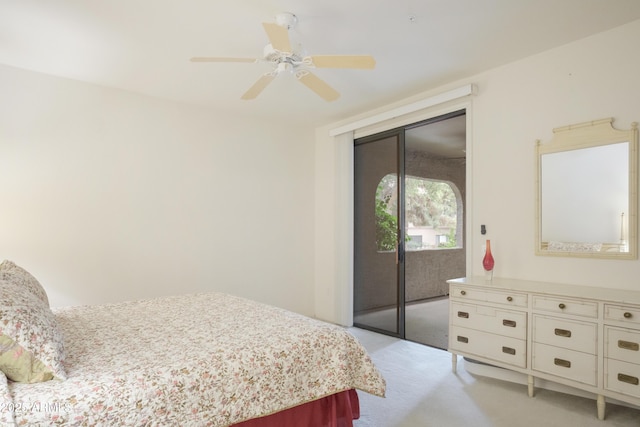 bedroom featuring access to exterior, light colored carpet, and ceiling fan