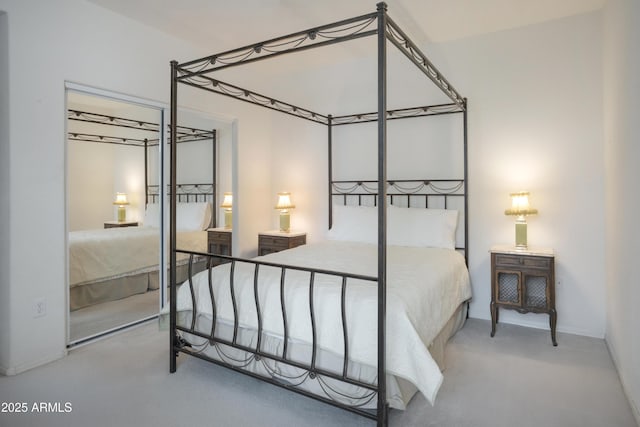 bedroom featuring carpet and baseboards