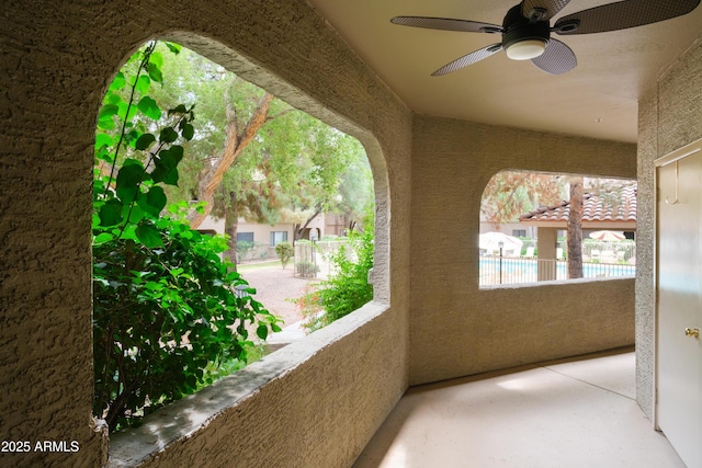 balcony featuring a ceiling fan