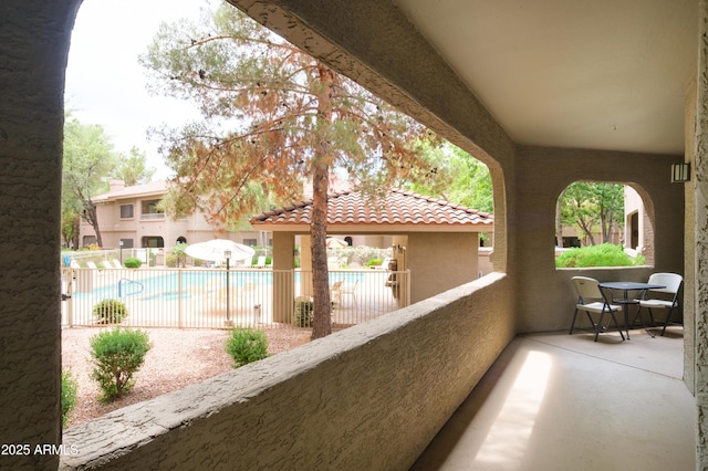 balcony with view of pool area