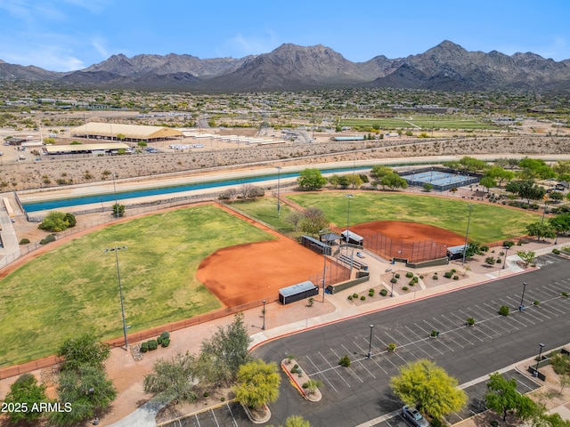 drone / aerial view of mountains and a pool