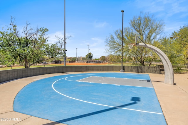 view of basketball court featuring community basketball court and fence