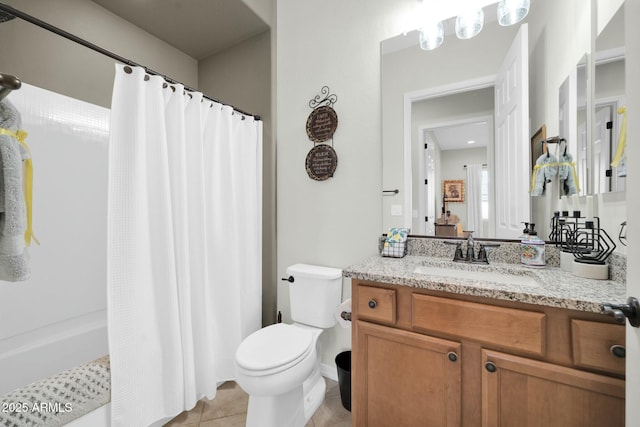 bathroom featuring vanity, walk in shower, tile patterned floors, and toilet