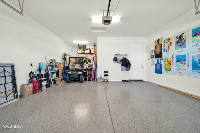 garage featuring a garage door opener