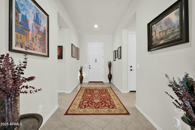 corridor with light tile patterned floors