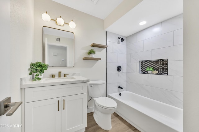 4720 W Northview Ave, Glendale, AZ 85301 - full bathroom featuring toilet, vanity, wood finished floors, and shower / bathtub combination