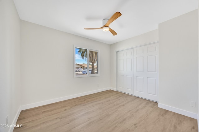 4720 W Northview Ave, Glendale, AZ 85301 - unfurnished bedroom with light wood-style flooring, a closet, baseboards, and ceiling fan