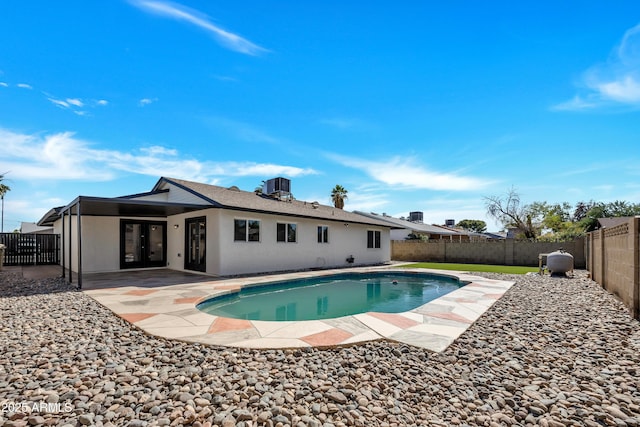 4720 W Northview Ave, Glendale, AZ 85301 - rear view of property featuring a fenced backyard, a patio area, cooling unit, stucco siding, and french doors