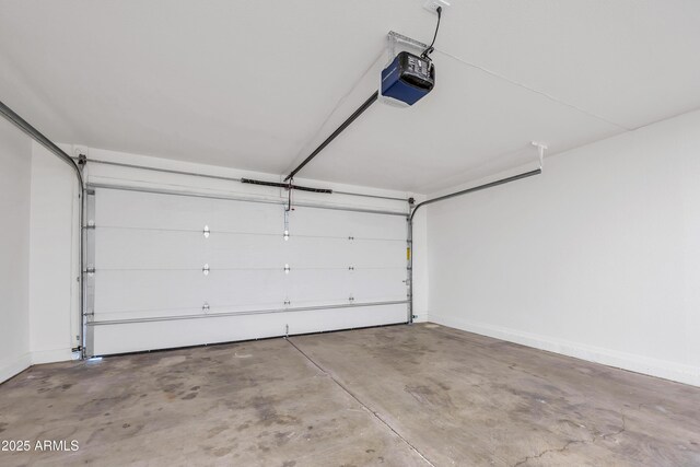 4720 W Northview Ave, Glendale, AZ 85301 - garage with a garage door opener and baseboards