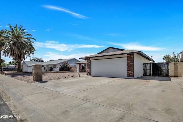4720 W Northview Ave, Glendale, AZ 85301 - single story home featuring a gate, concrete driveway, an attached garage, and stone siding