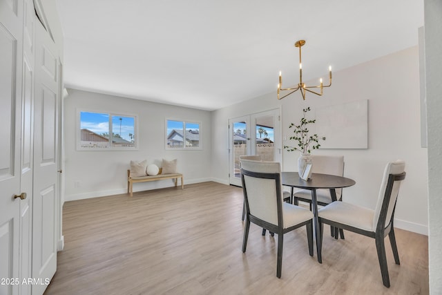 4720 W Northview Ave, Glendale, AZ 85301 - dining room with a chandelier, light wood-type flooring, and baseboards