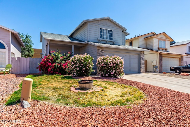 3829 W Camino Del Rio, Glendale, AZ 85310 - traditional-style house with a garage, driveway, a fire pit, and brick siding