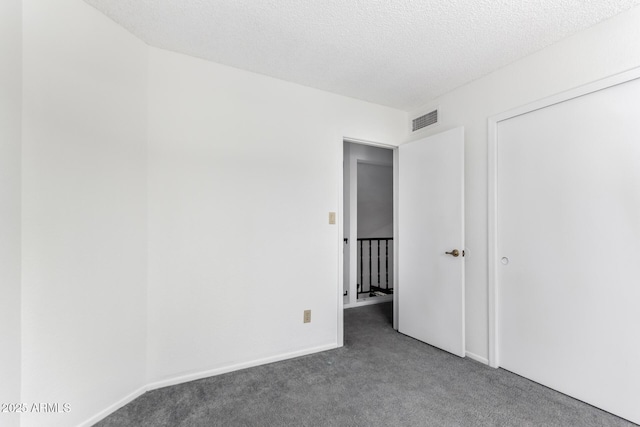 3829 W Camino Del Rio, Glendale, AZ 85310 - unfurnished room with carpet, baseboards, and a textured ceiling