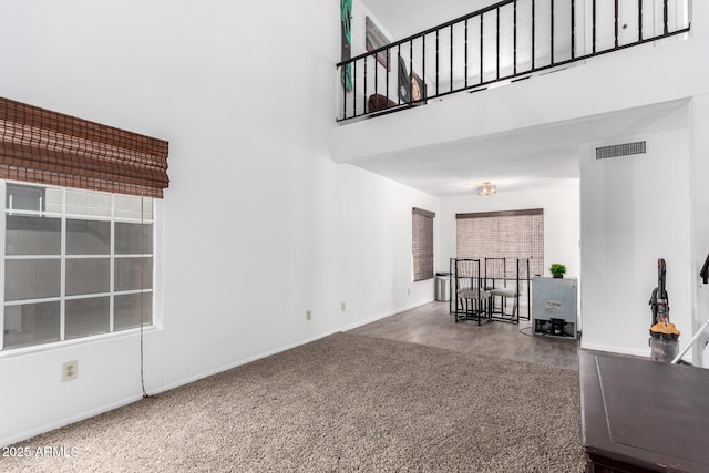 3829 W Camino Del Rio, Glendale, AZ 85310 - carpeted living room with a towering ceiling and baseboards