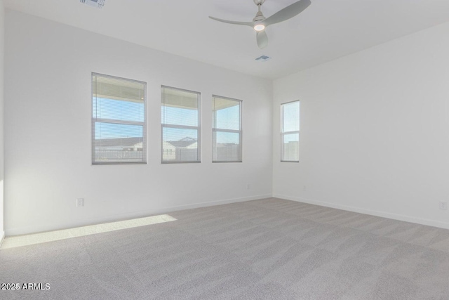 carpeted empty room with ceiling fan