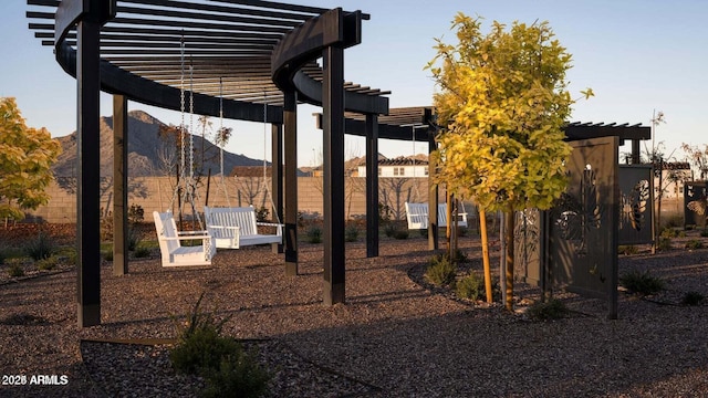 view of yard featuring a mountain view and a pergola