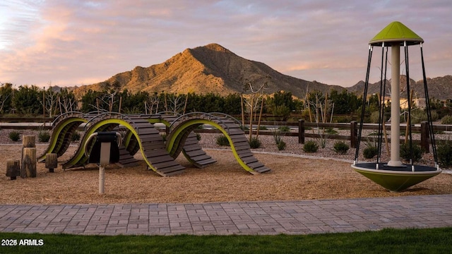 playground at dusk with a mountain view