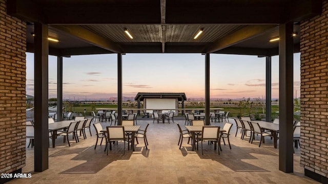 view of patio terrace at dusk