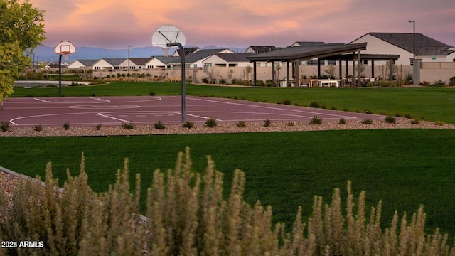 view of sport court featuring a gazebo and a lawn