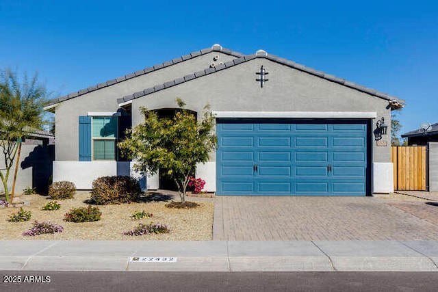 ranch-style home featuring a garage