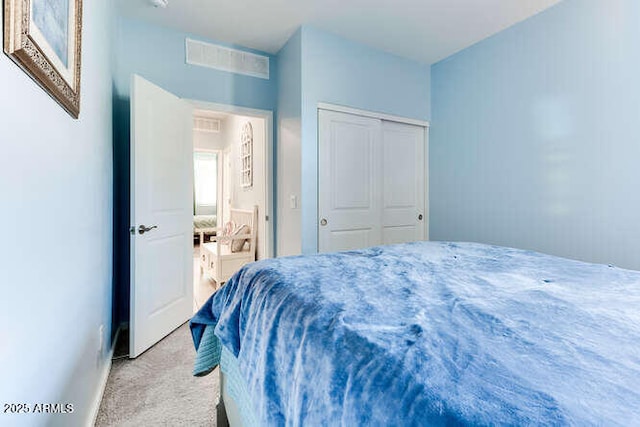 carpeted bedroom featuring a closet