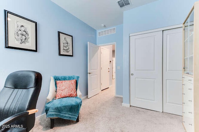 sitting room with light colored carpet