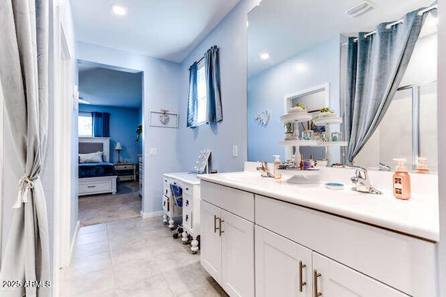 bathroom with vanity and tile patterned flooring