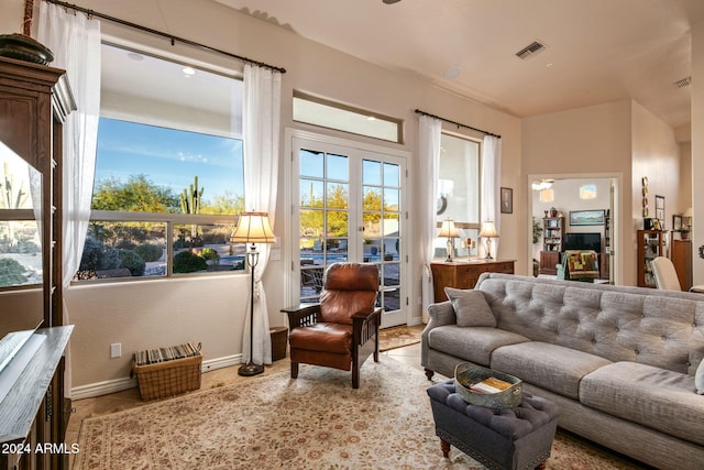 interior space with french doors and light tile patterned flooring