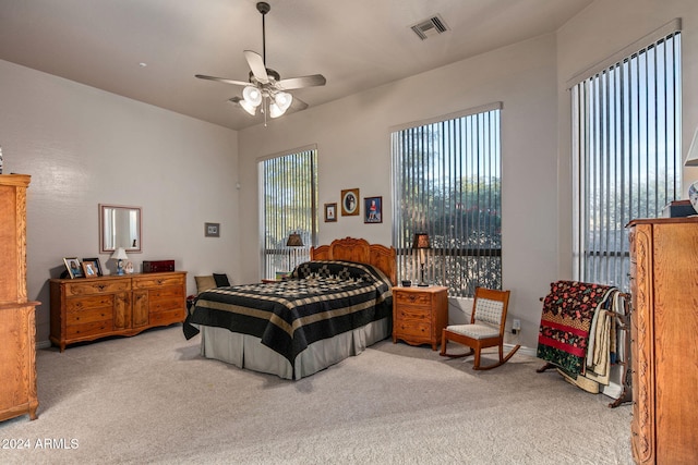 bedroom with light colored carpet and ceiling fan